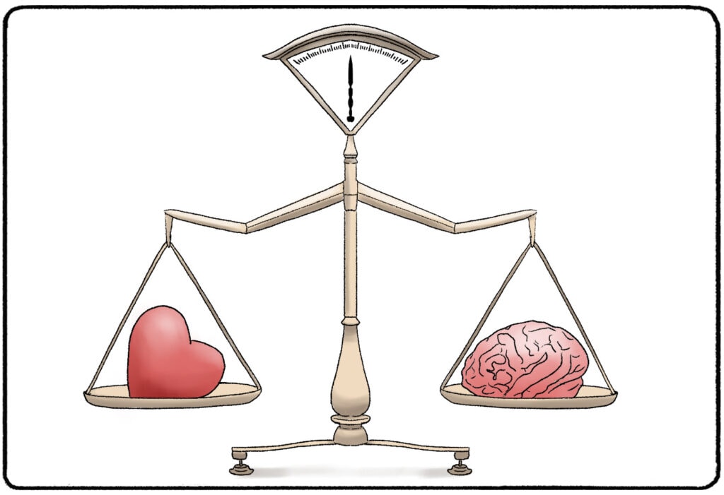 a scale containing a heart on one side and a brain on the other side