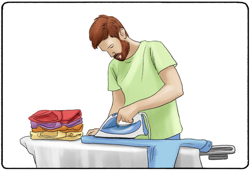 a man ironing his clothes